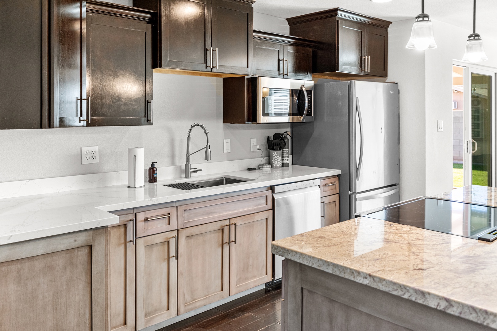 Cook your favorite meals in this modern kitchen featuring granite counters, stainless appliances, and everything you need for comfortable stays.