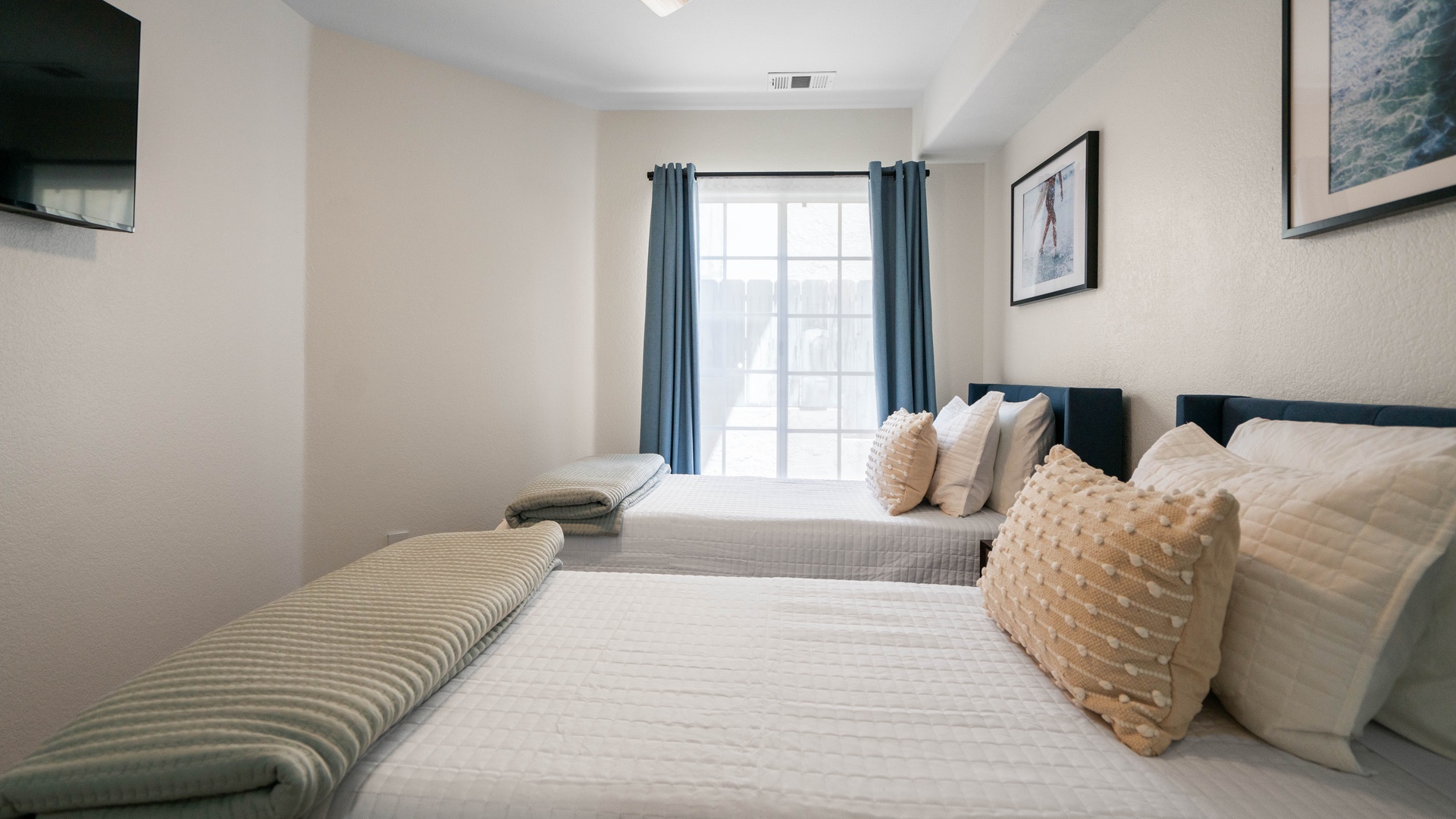 Bedroom 3: Two Twin Beds with walk-in closet and black-out curtains. Located on first floor.