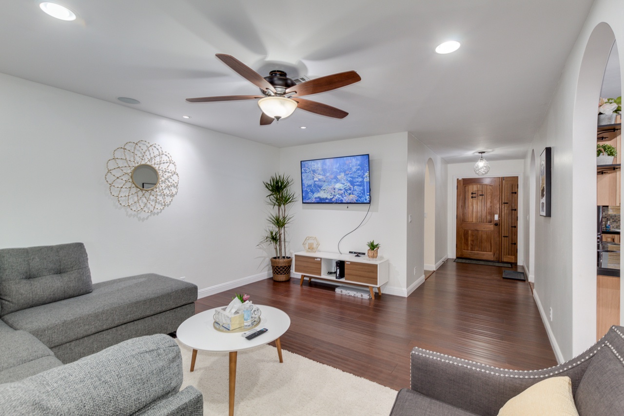 Living room with plush sofas and a flat screen tv with streaming capabilites