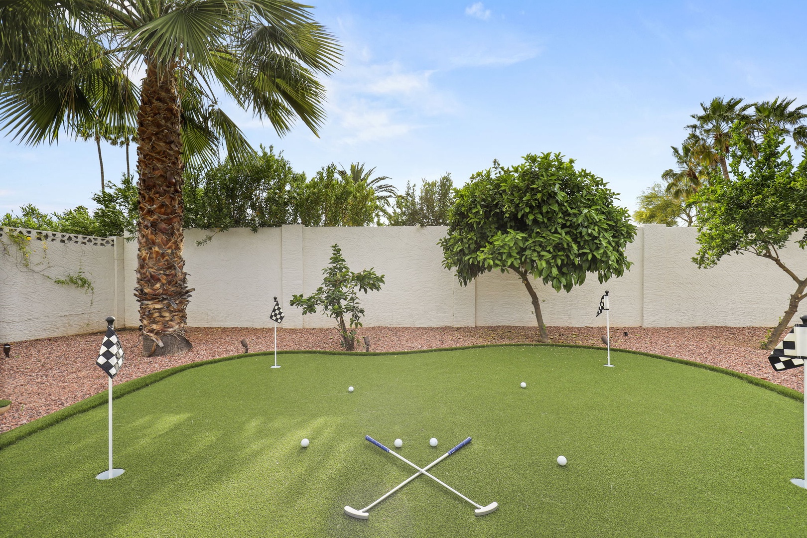 Practice your short game on the backyard putting and chipping green!