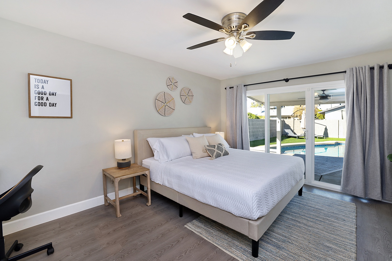 Large Master Bedroom with King bed, 55" Smart Roku UHD TV, with direct access to the covered patio and pool.