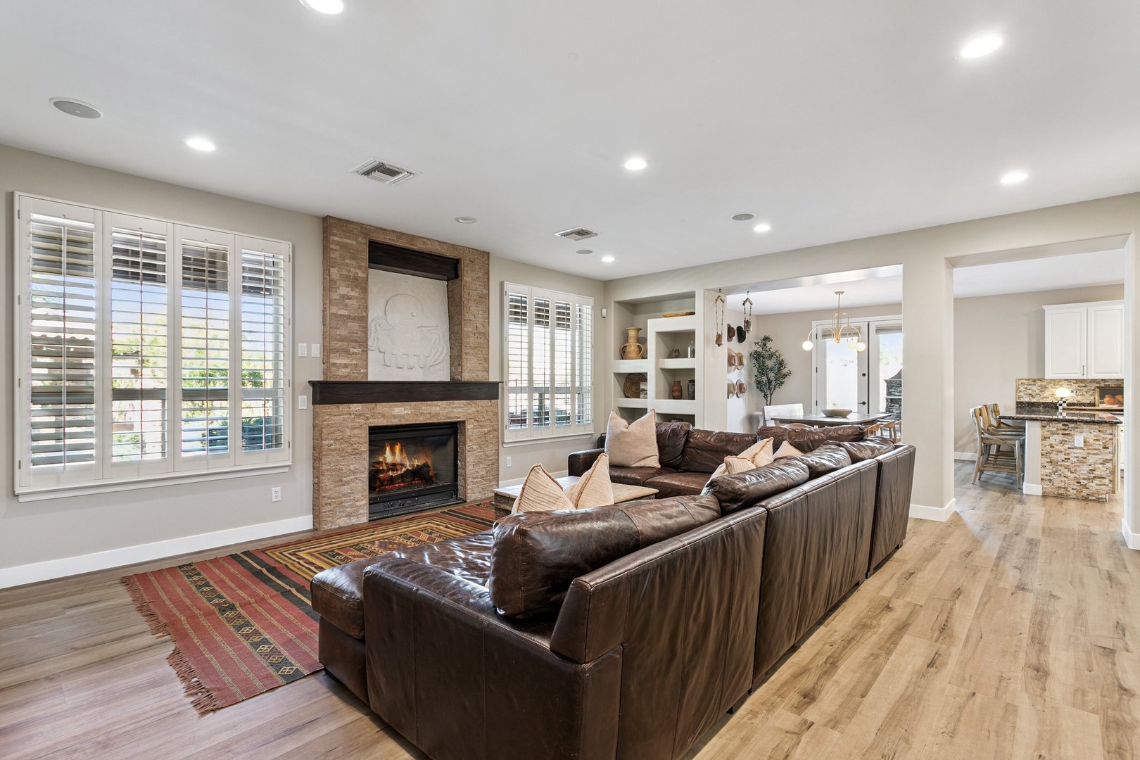 Sink into luxurious leather seating while the fireplace crackles warmly, creating your perfect retreat for relaxation and conversation.