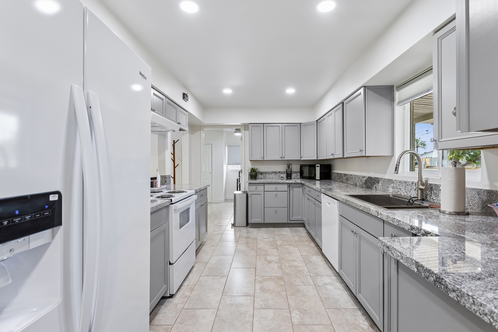 Your spacious kitchen awaits with modern appliances, gleaming granite counters, and everything you need to whip up memorable vacation meals together.