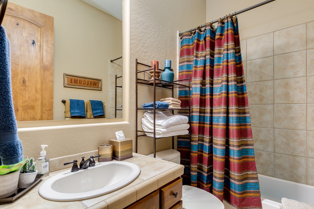 Bathrooms are stocked with items including: shampoo, conditioner, body wash, and fresh towels.