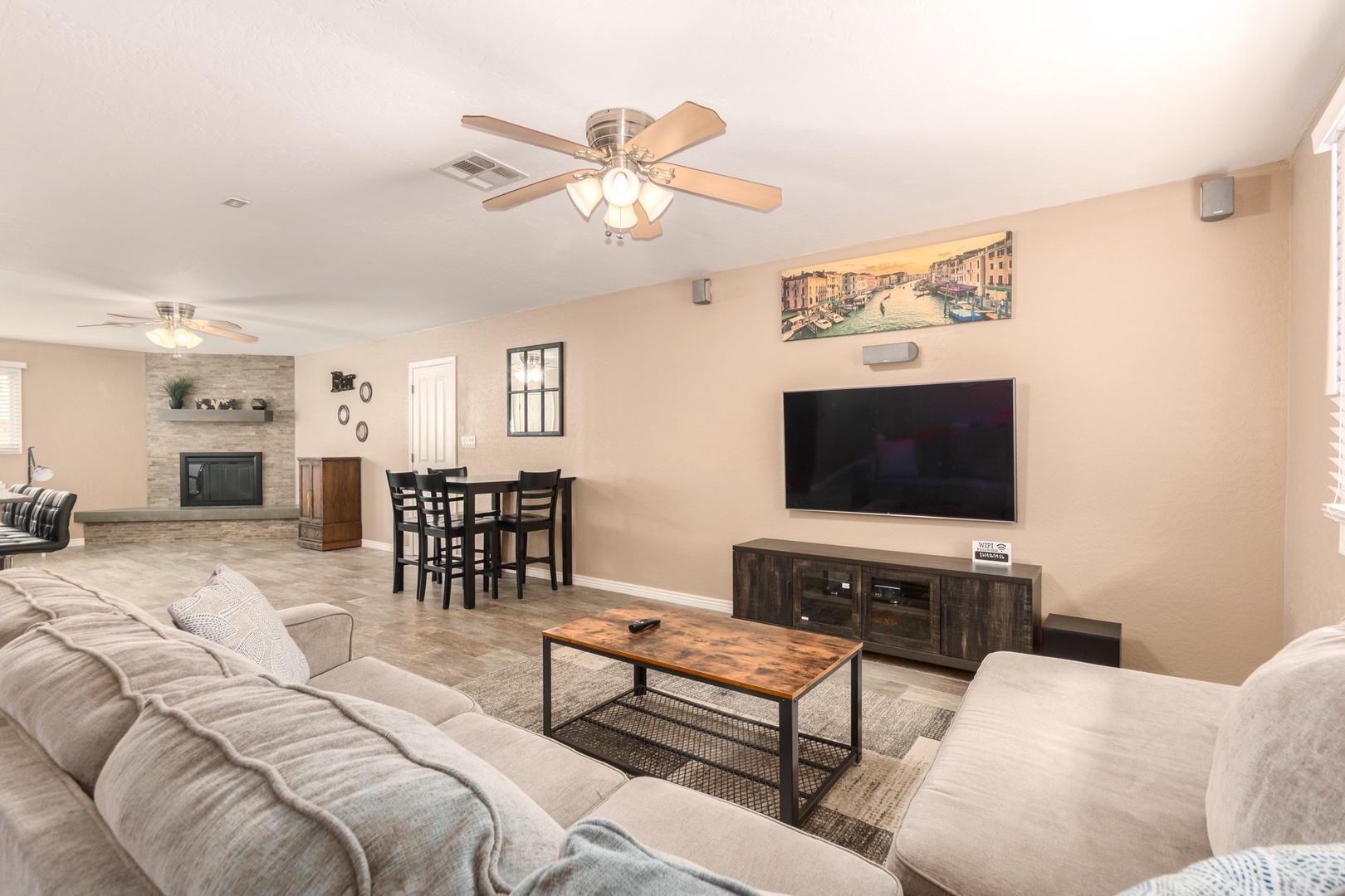 You'll find a large sectional sofa and a flat screen tv connected to streaming services.