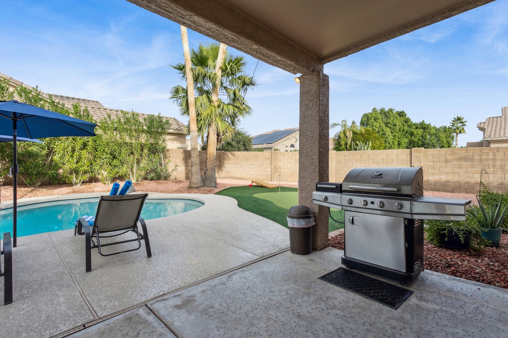 Your covered patio offers the perfect blend of relaxation with a sparkling pool and premium BBQ setup for memorable evenings.