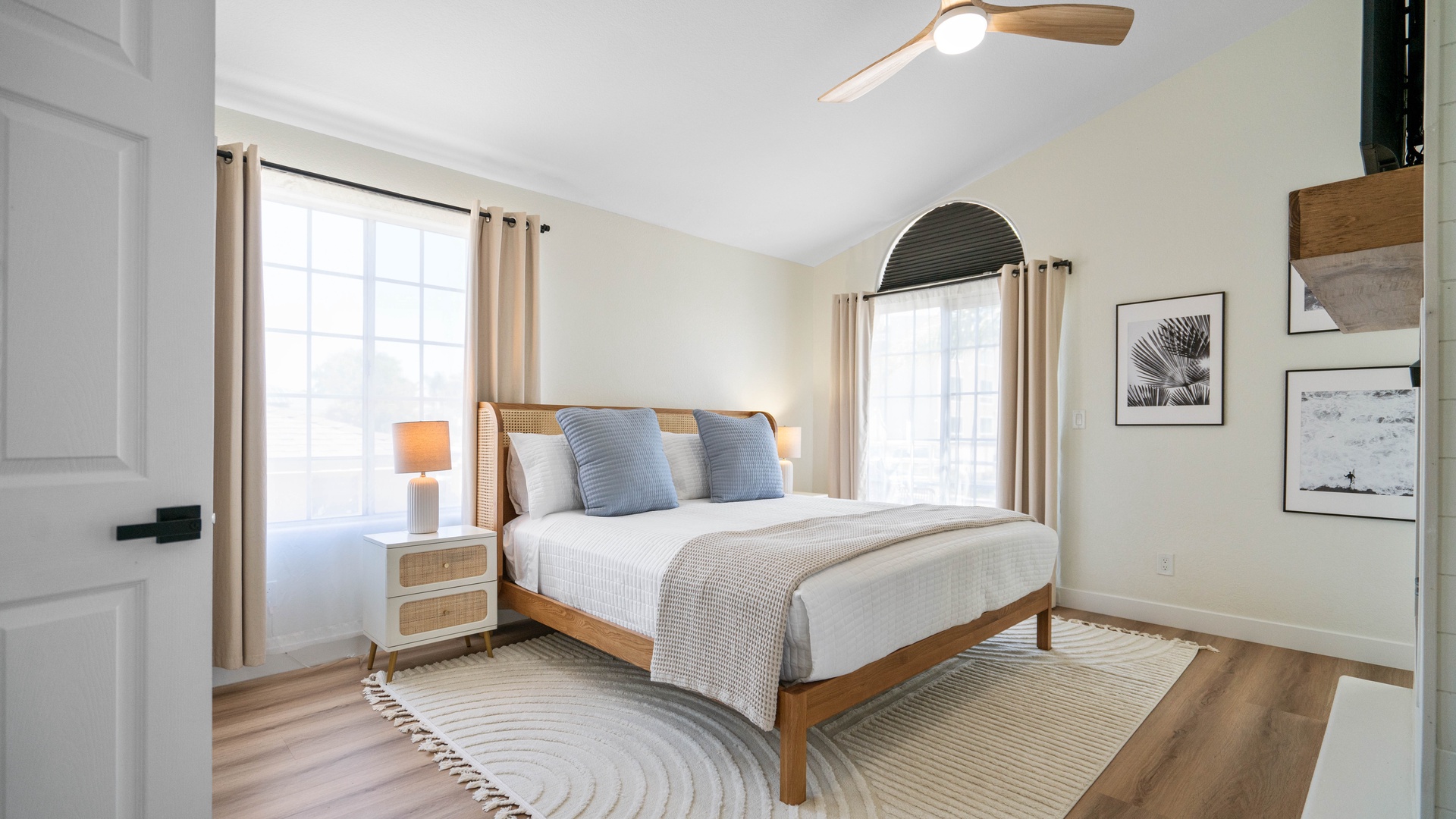 Primary Bedroom with King Bed, ensuite bathroom with soaking tub and shower, balcony, and smart tv.