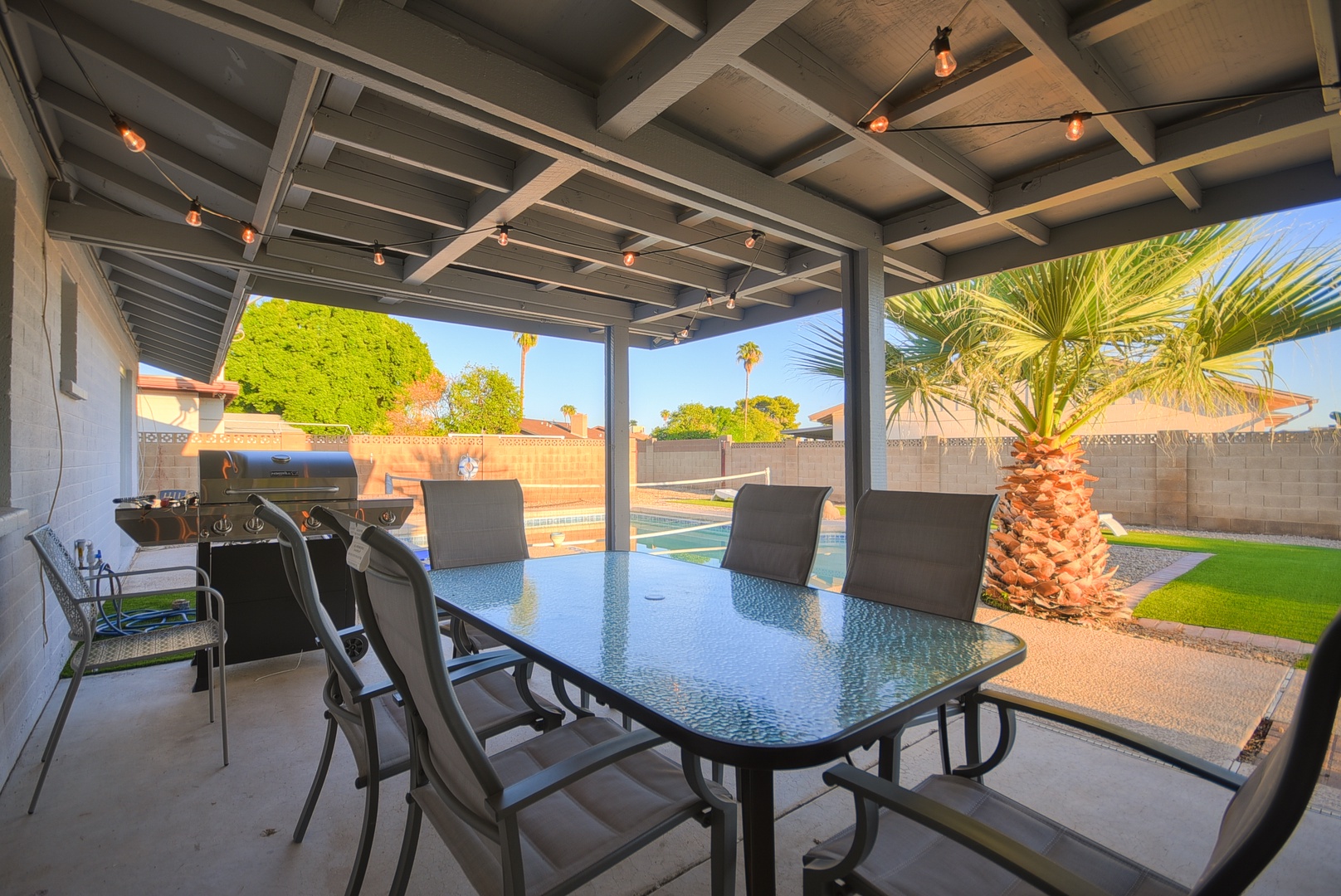 Backyard with sparkling pool (non-heated) and a putting green!