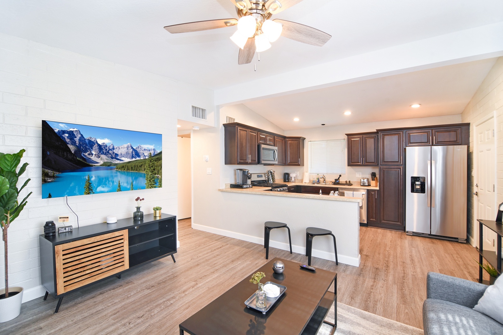 Unit 2 Living Room & Kitchen. 55" Smart TV w/ Netflix, Hulu, Prime, and more!