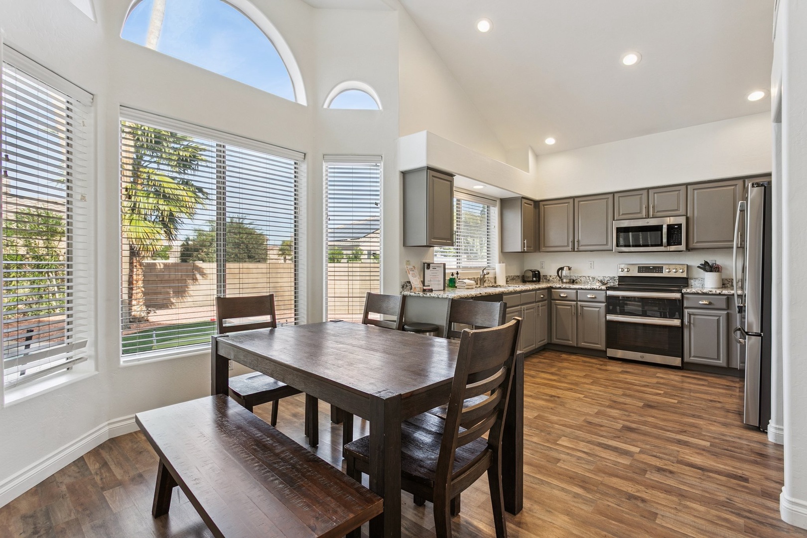 Enjoy preparing meals in your fully-equipped kitchen with stainless steel appliances, then gather around the dining table in this bright, airy space.