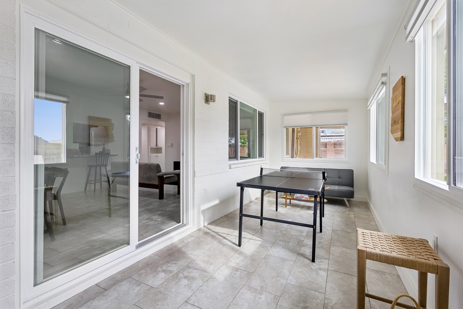 Step into your private enclosed patio, where sunny mornings call for a friendly game of ping pong and afternoon coffee breaks unfold in quiet comfort.