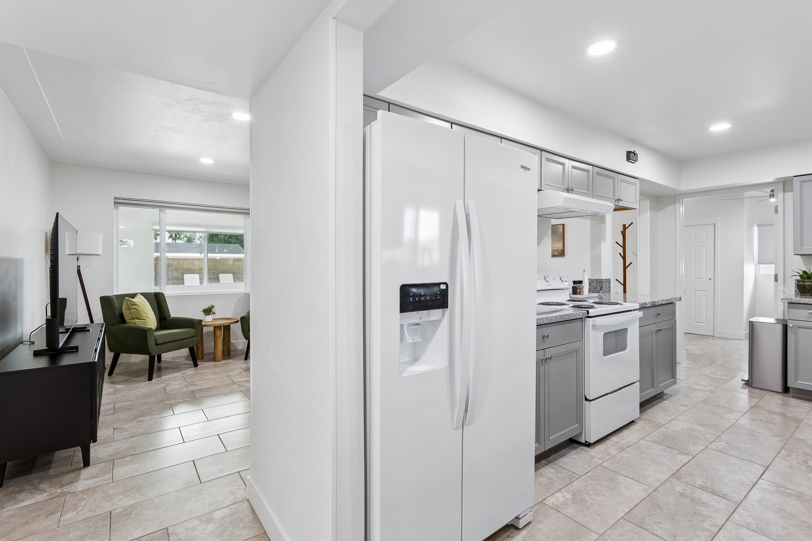 Step into your bright, open kitchen where modern appliances and ample counter space make meal prep a breeze. The cozy living area invites you to relax after a day of exploring.