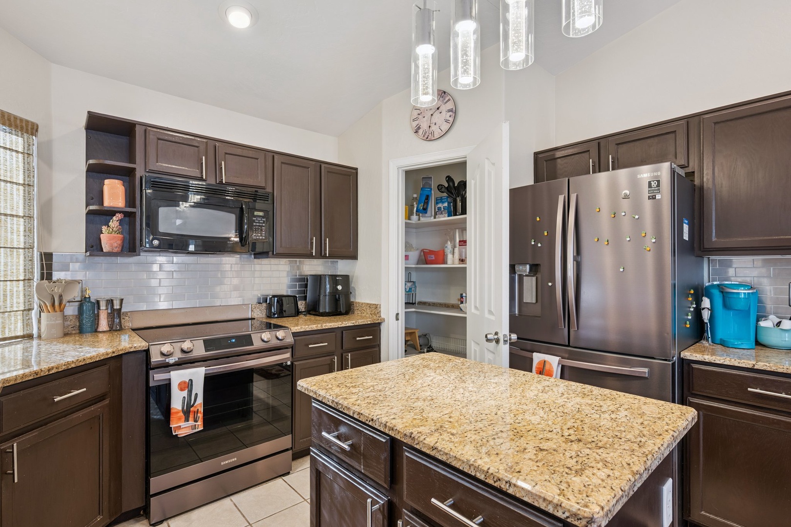 Your fully equipped gourmet kitchen awaits with granite countertops, stainless steel appliances, and everything you need to create memorable meals.