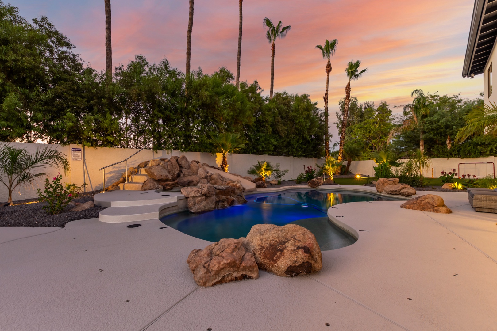 resort style pool with hot tub and slide