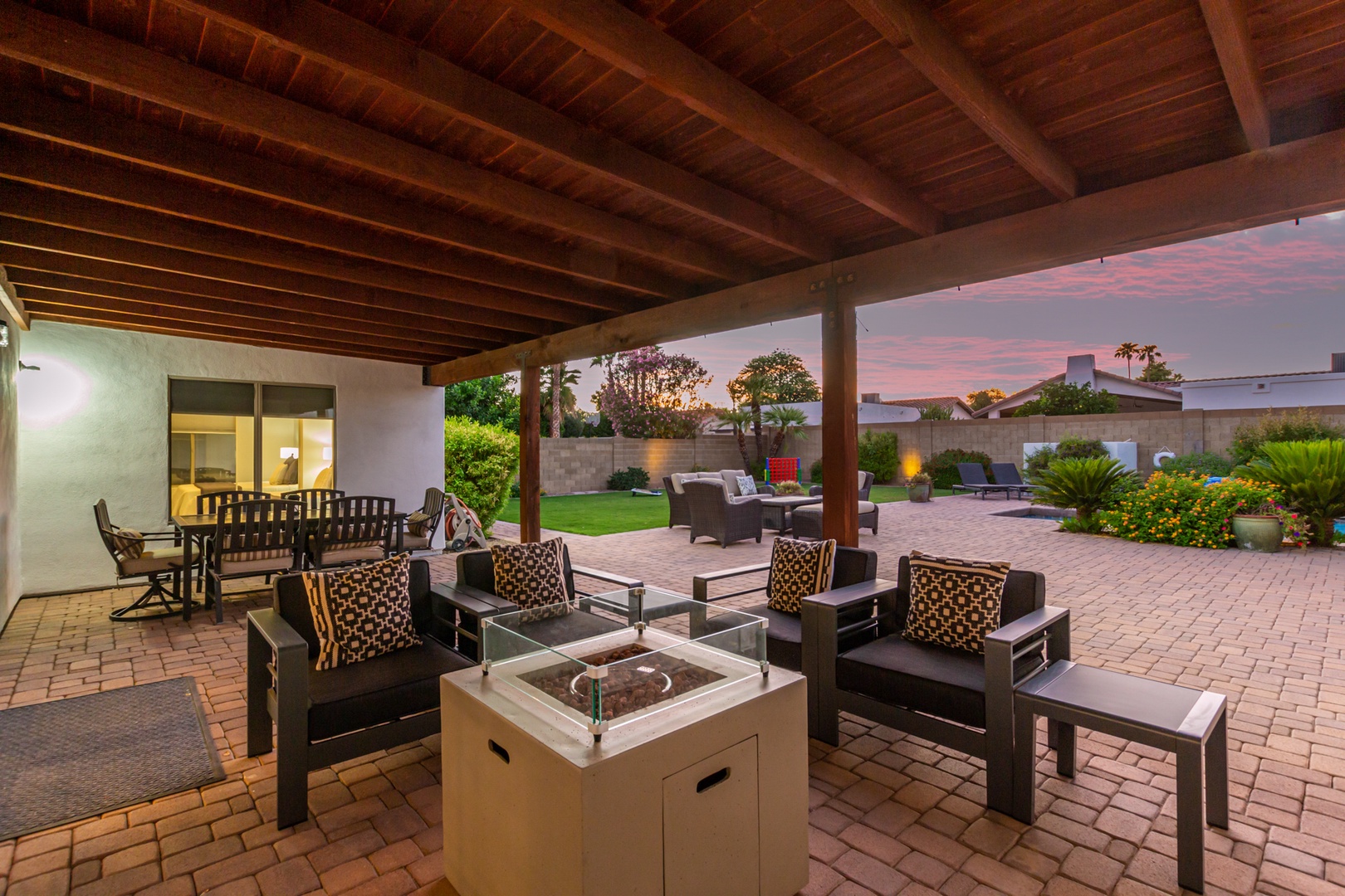 Outdoor covered patio dining table, lounge with fire pit