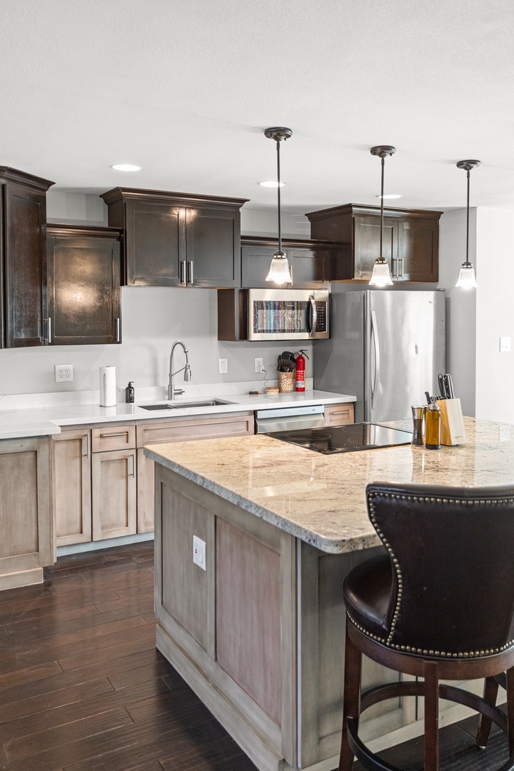 Your gourmet kitchen awaits with granite counters, stainless appliances, and island seating for memorable meals together.