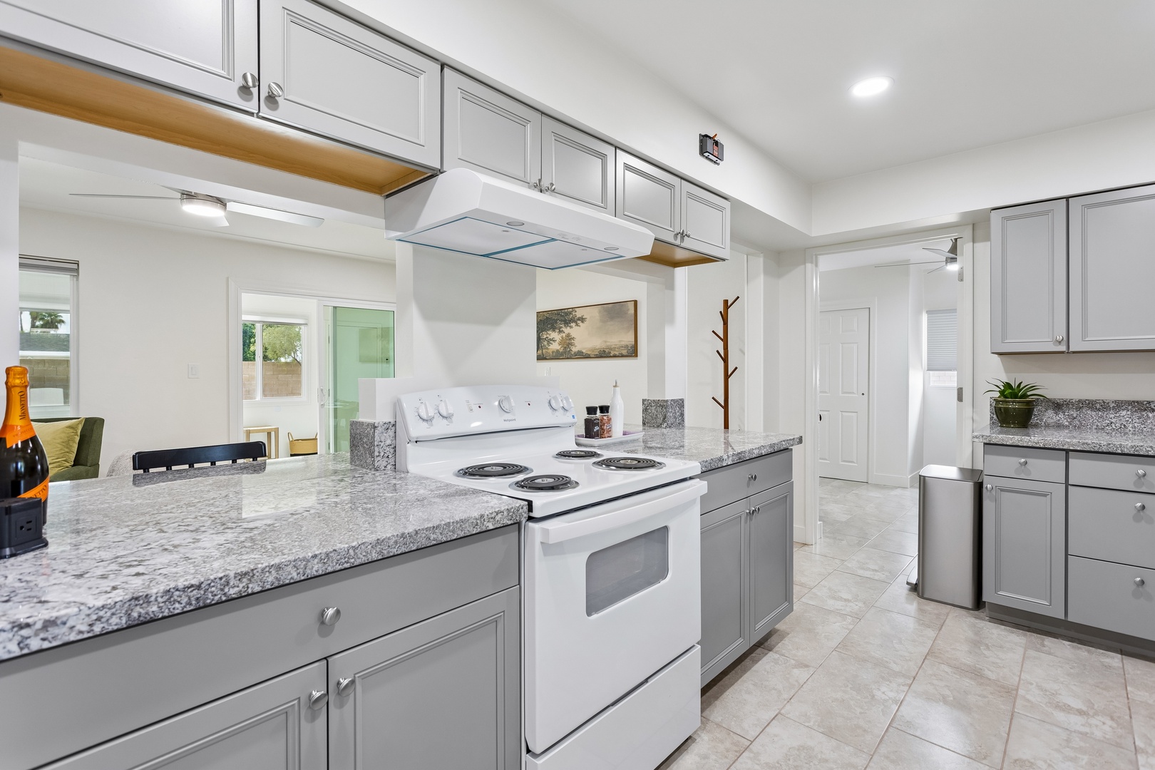 Your bright, fully-equipped kitchen features sleek granite countertops and modern appliances, giving you everything you need to prepare meals in style during your stay.