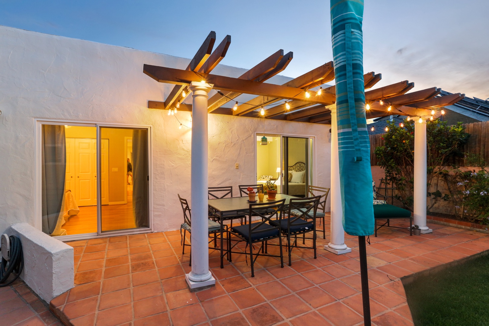 Private backyard with dining table and chairs