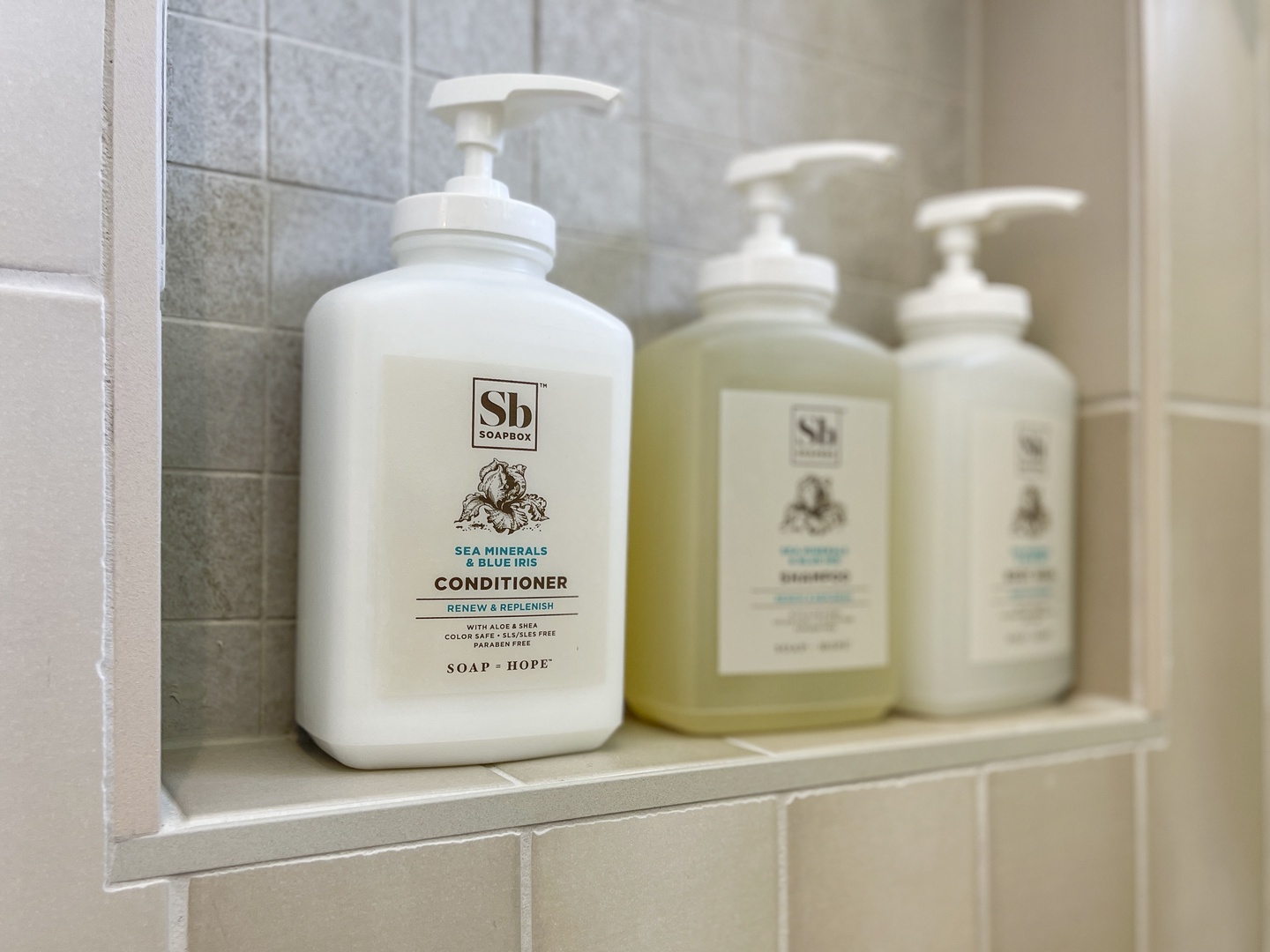 Bathrooms are stocked with items including: shampoo, conditioner, body wash, and fresh towels.
