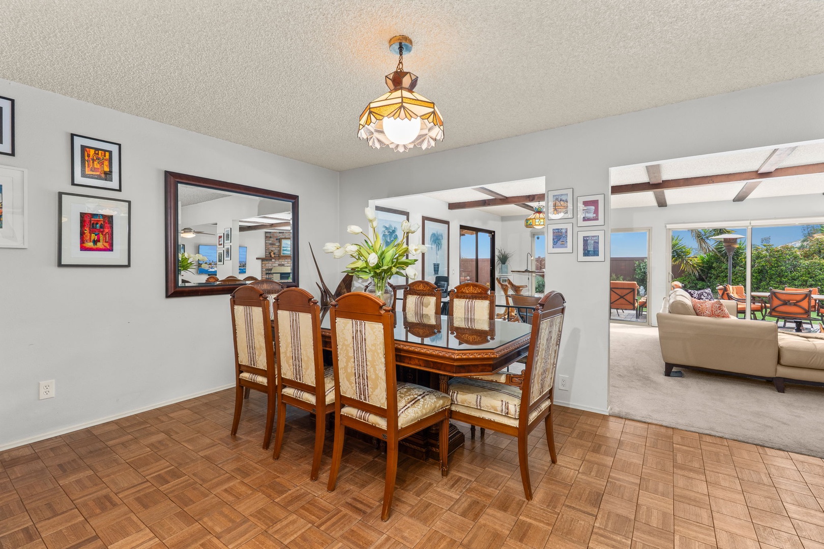 Gather around this elegant dining table for memorable meals, with stunning garden views through floor-to-ceiling windows.