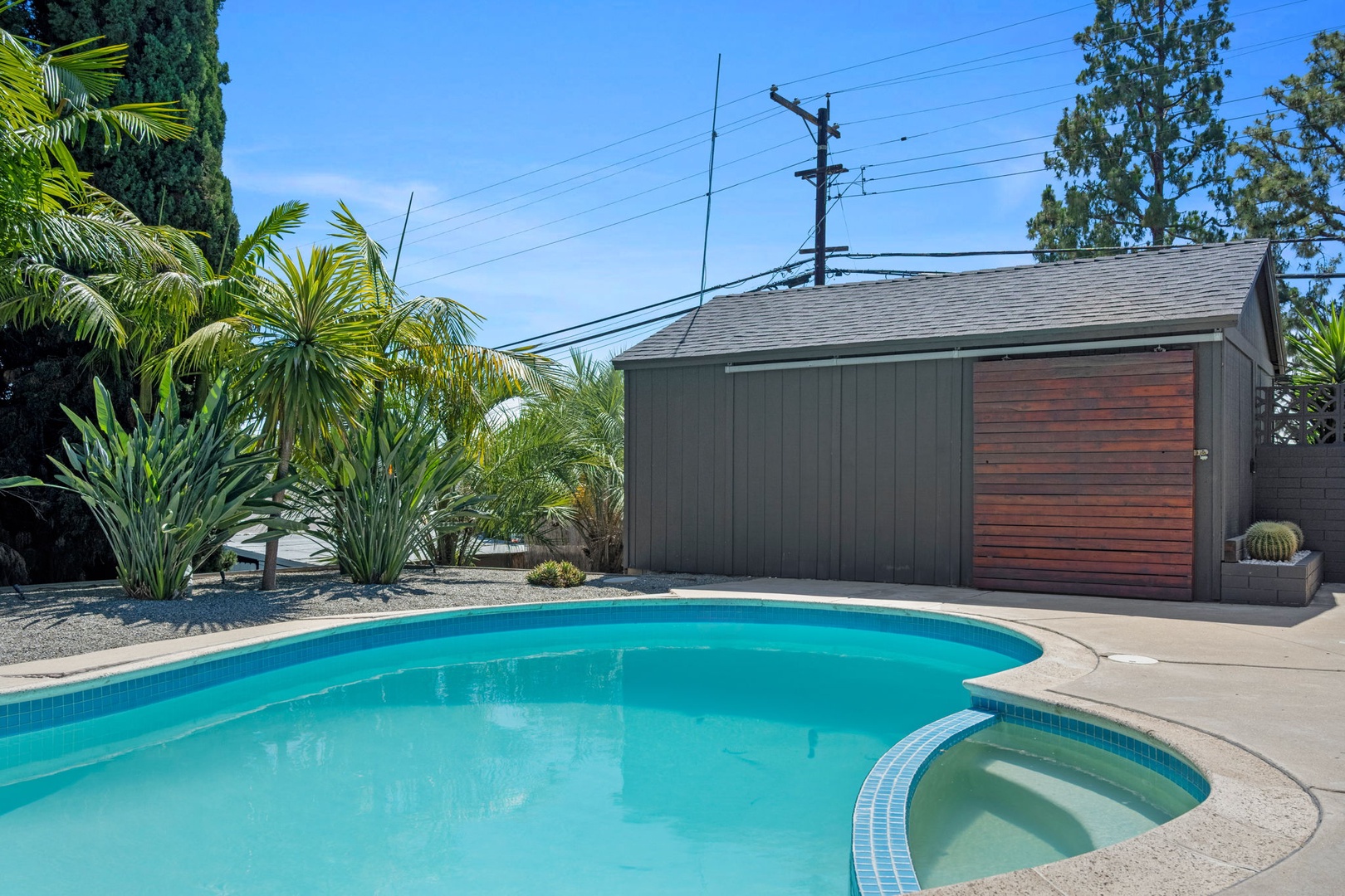 This sparkling pool and spa area surrounded by lush tropical palms invites you to soak up the California sunshine and unwind in your own private outdoor retreat.