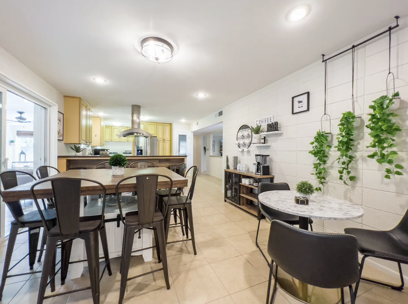 Bright open kitchen and dining combo with a coffee bar and breakfast nook