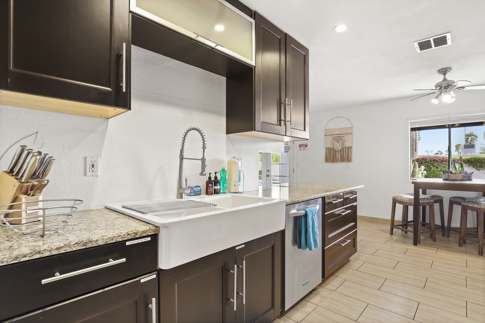 Modern kitchen outfitted with stainless steel appliances and everything you need to cook up all your favorites - Pots, Pans, Utensils, Spice Rack, Toaster, Kettle, Blender, Drip Coffee Maker, Filtered Water, Ice Maker.