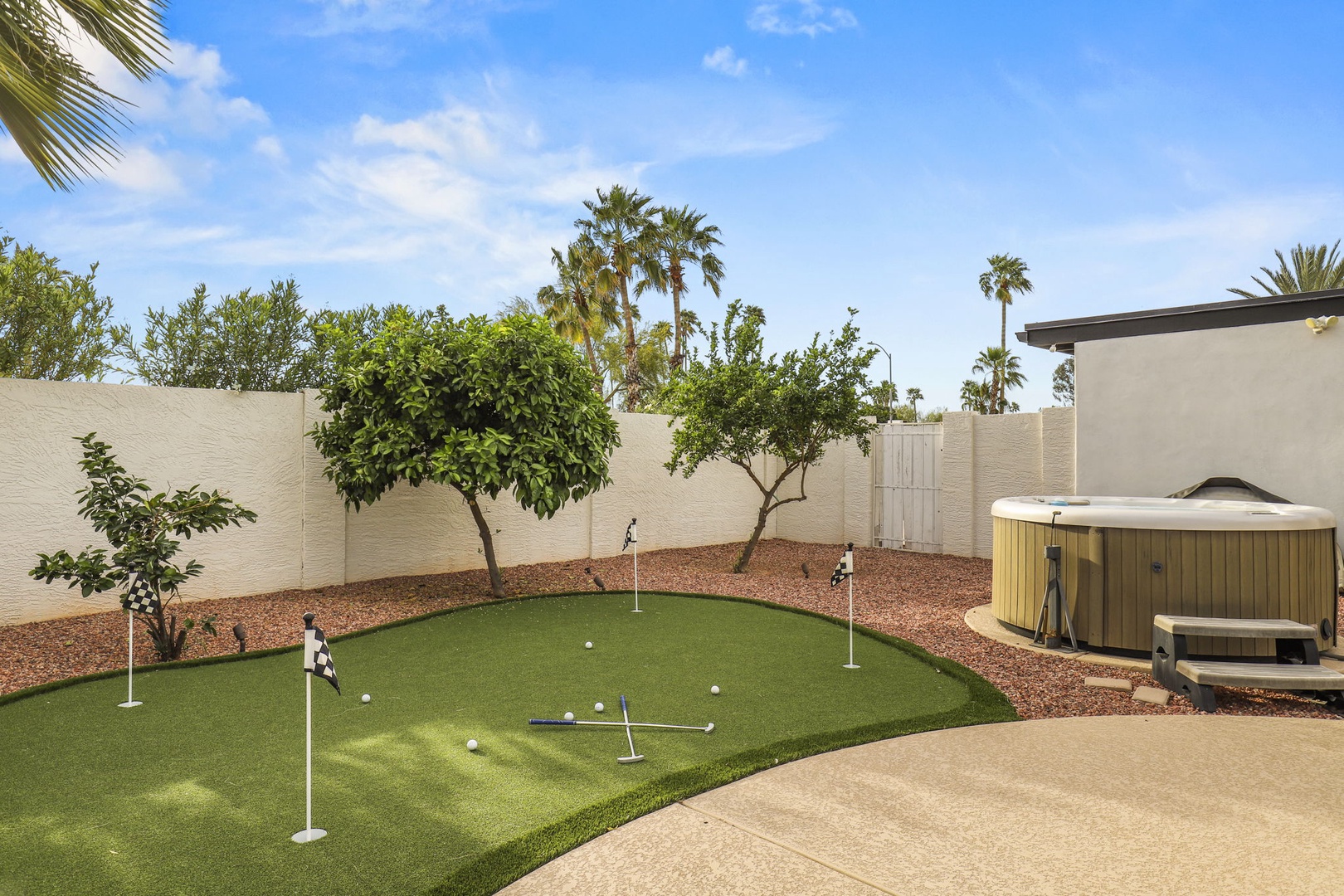 Practice your short game on the backyard putting and chipping green!