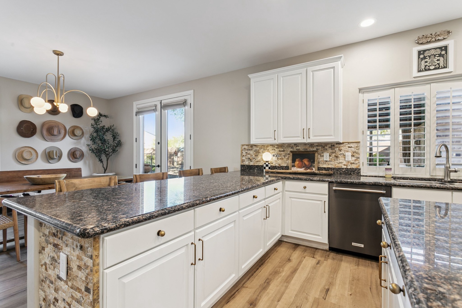 Your dream kitchen awaits with gleaming granite counters, spacious island, and modern appliances perfect for cooking memorable meals together.