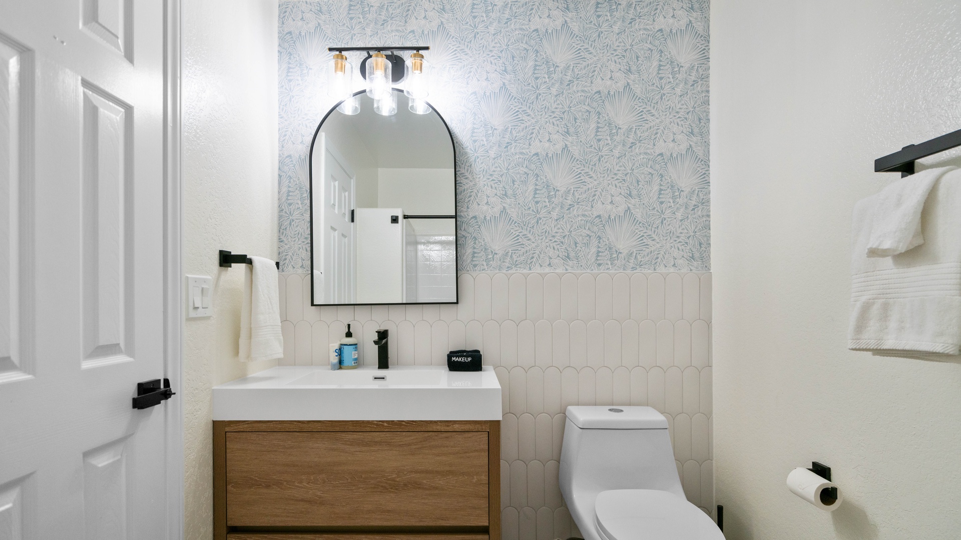 Bathroom 2: Ensuite full bathroom with sink and bathtub. Located on second floor.