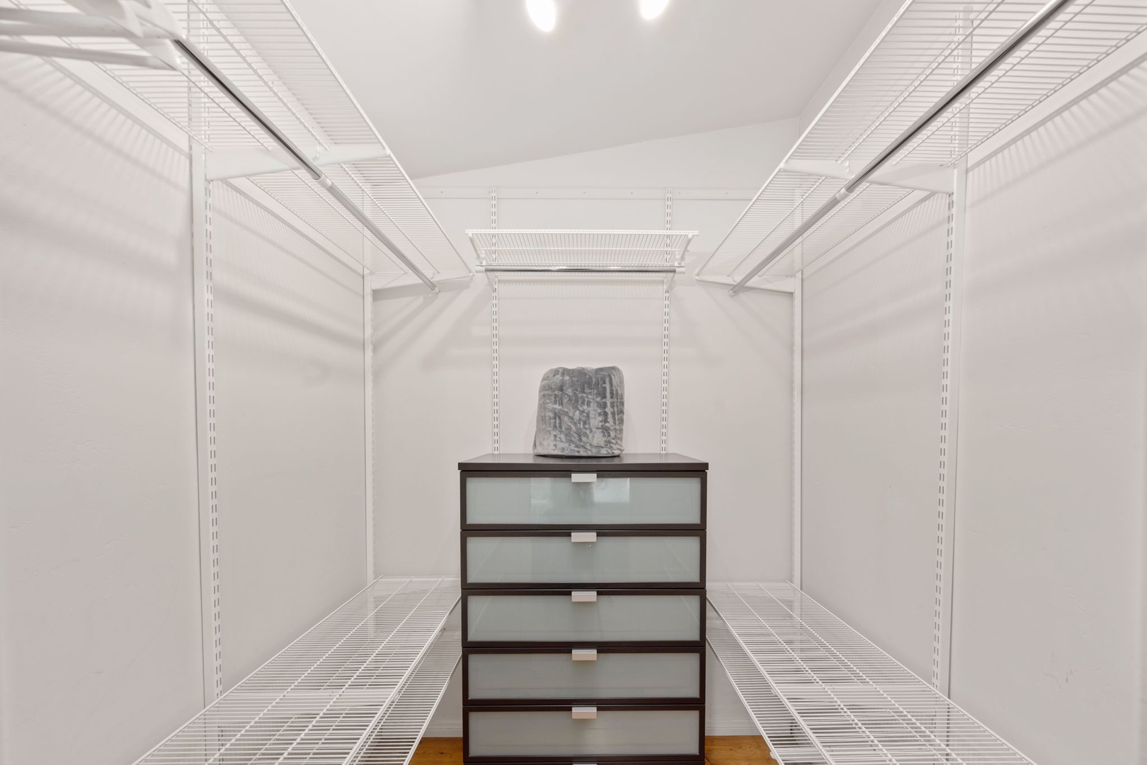 A spacious walk-in closet in the primary bedroom