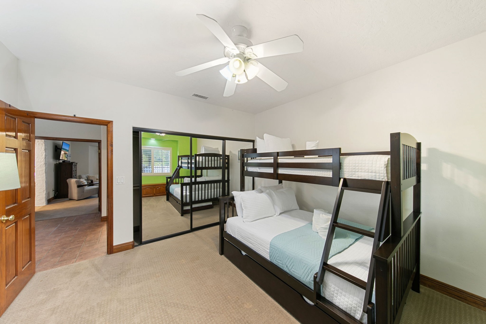 Drift off in your spacious bunk bedroom, where the ceiling fan keeps you cool and comfortable all night long. Bunk features a twin top, double bottom, and twin pull-out trundle.