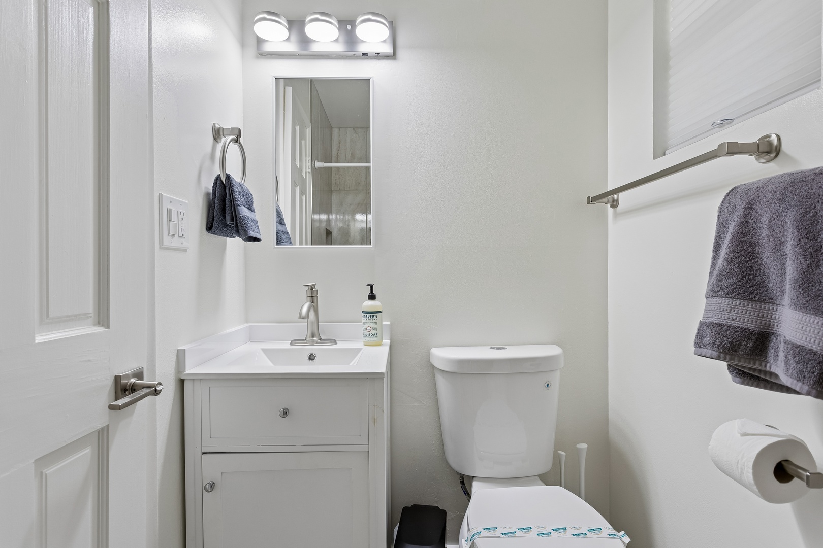 Step into your freshly renovated bathroom, where sleek modern fixtures and crisp white surfaces create a clean, calming retreat perfect for unwinding after a day of adventure.