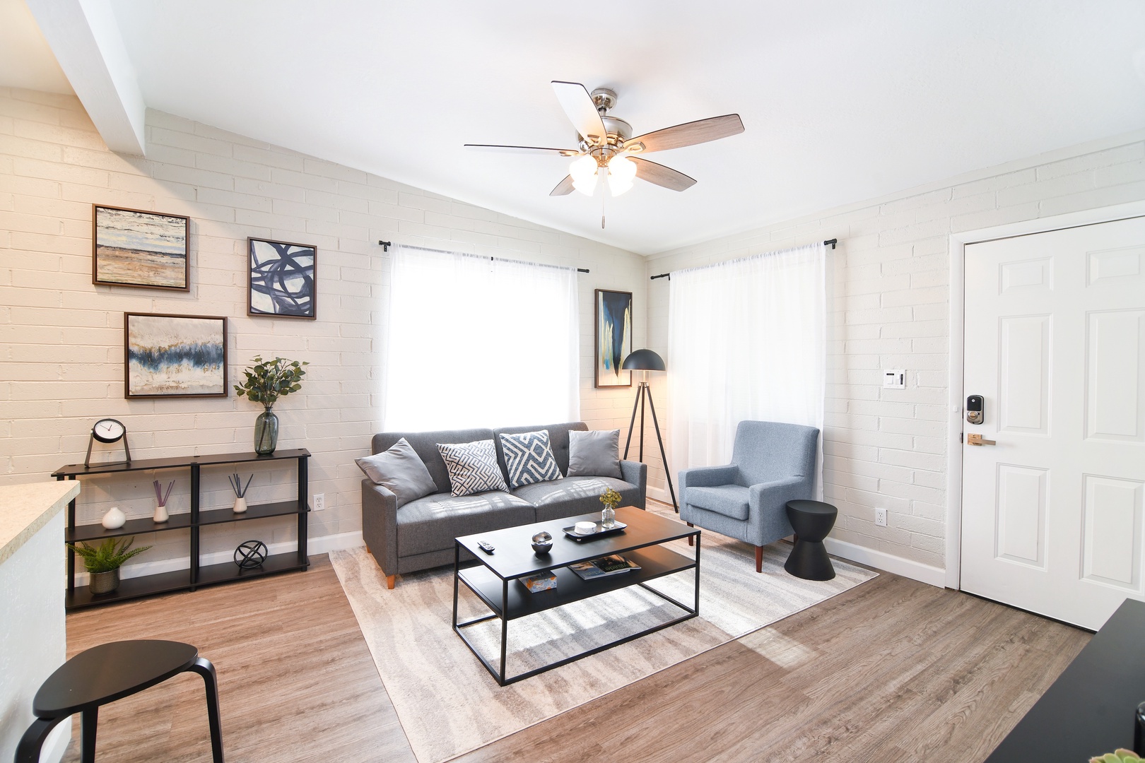 Comfortable, bright living room. Sofa can be converted to a queen bed for more sleeping space