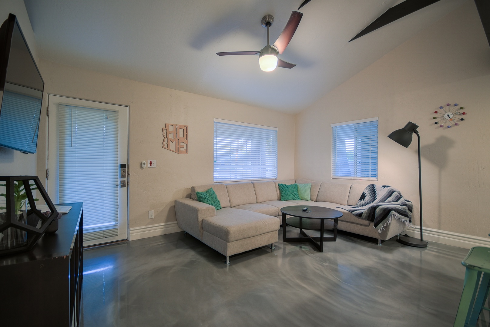 There is a large sofa sectional with plenty of seating for your entire group to relax