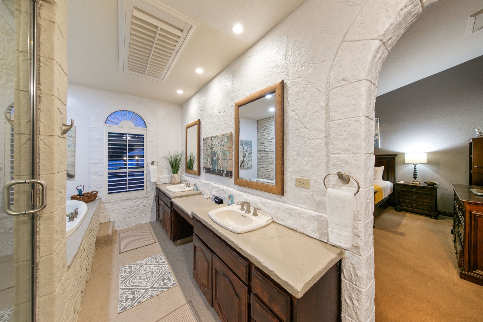Unwind in your spacious master ensuite featuring vanities (left sink out of order), elegant stone finishes, and a luxurious soaking tub for ultimate relaxation.