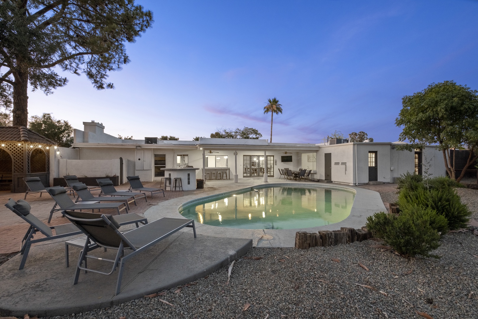 Relax or entertain out back, with an inviting pool, built-in BBQ, and impressive gazebo
