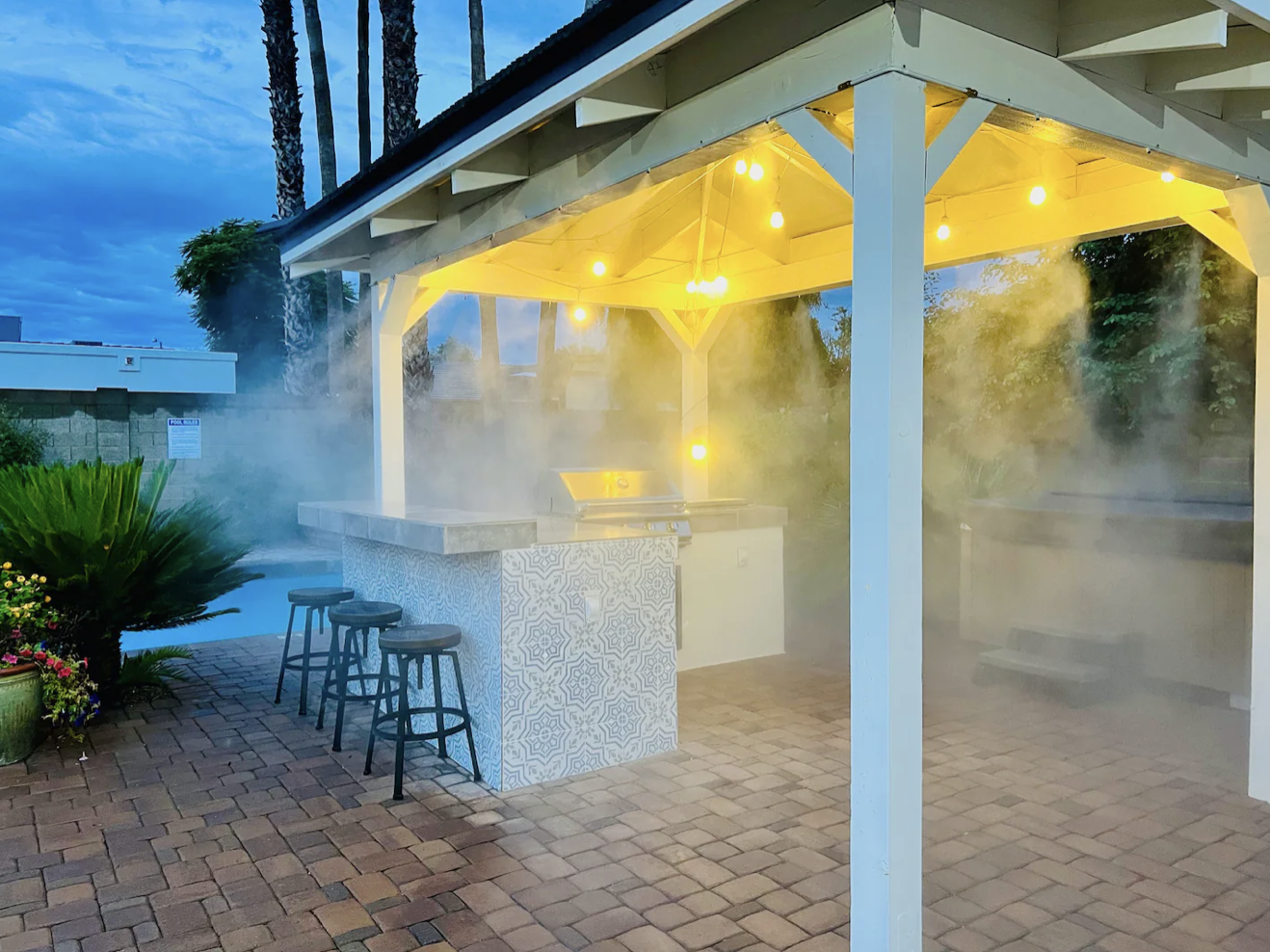 Patio misting system over outdoor BBQ bar