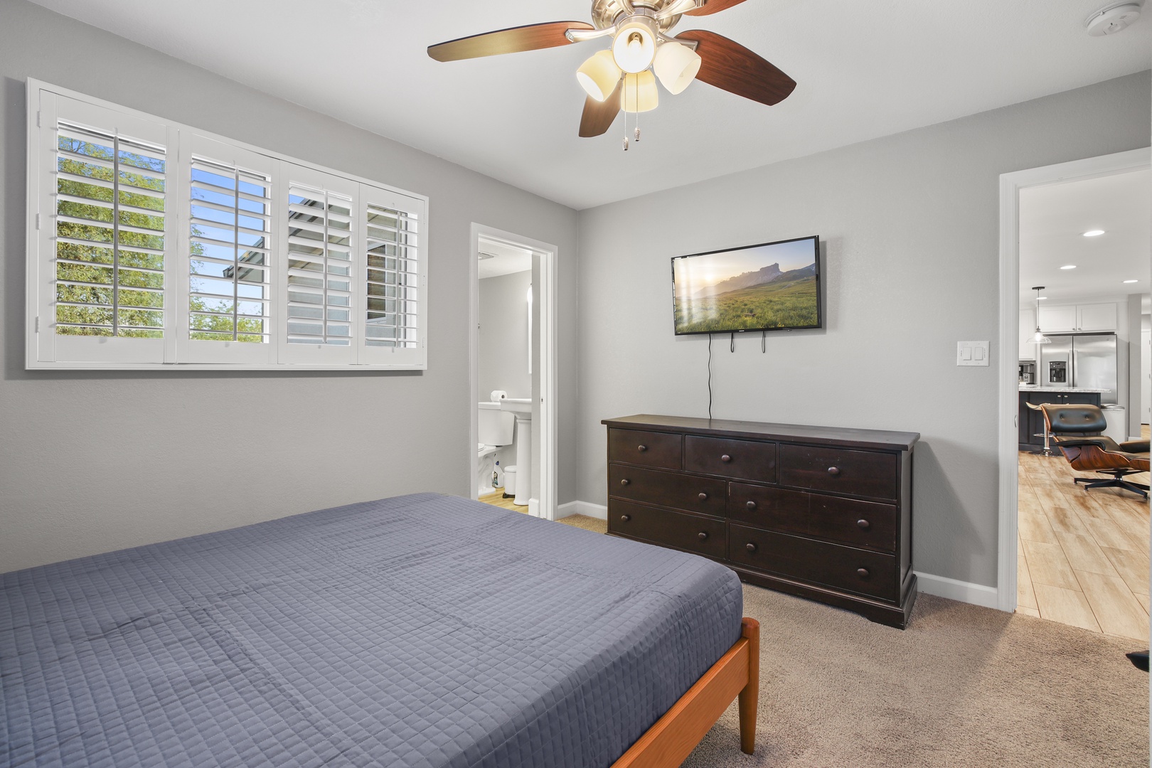 Three spacious bedrooms with beds covered in comfortable linens.