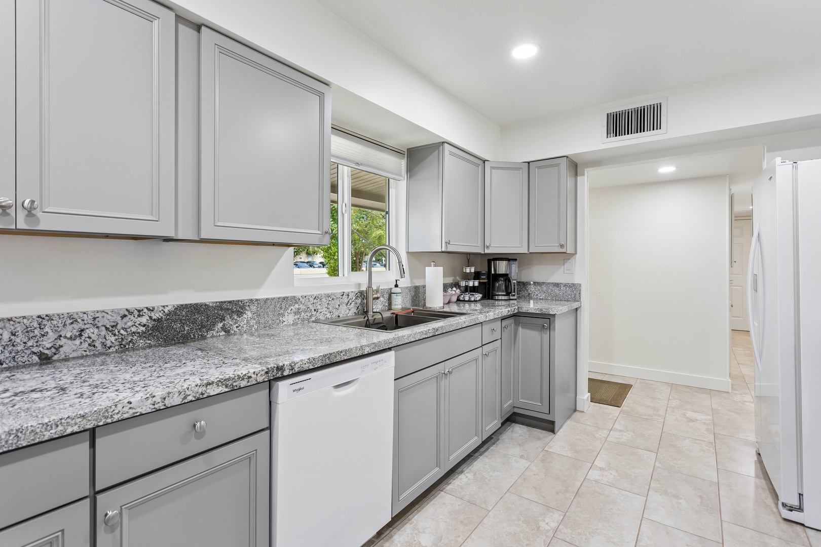 Prepare your favorite meals in this sleek, fully equipped kitchen with granite counters and modern appliances. Bright and airy, it's designed to make cooking feel effortless during your stay.