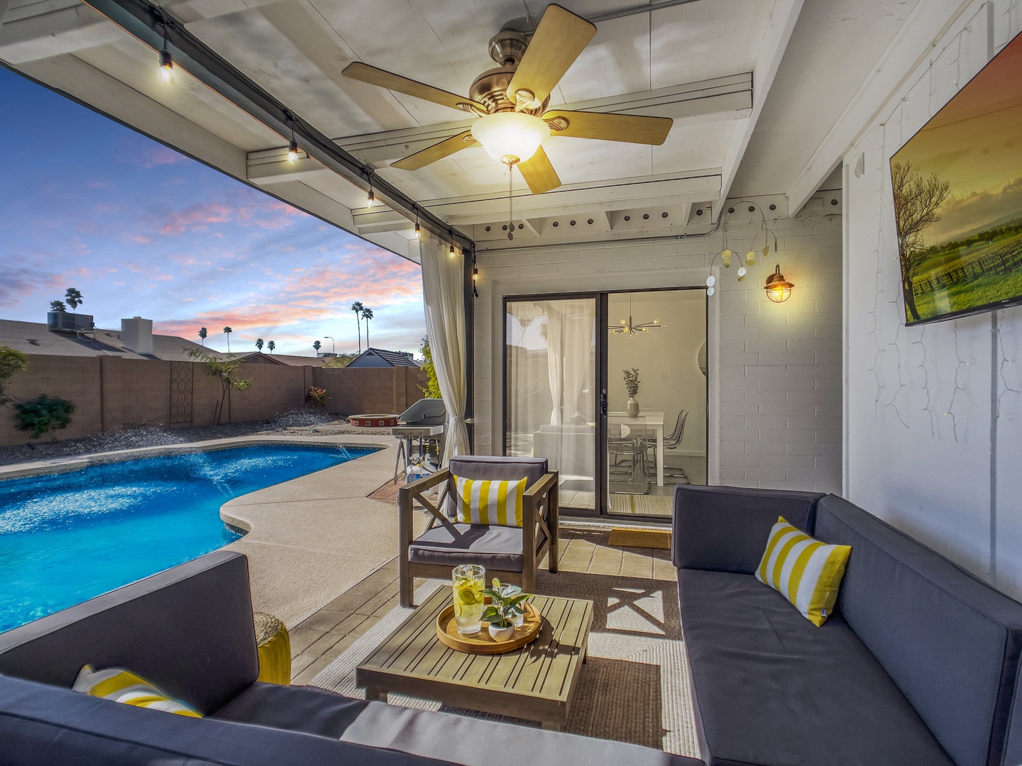 Poolside cabana with sofa & 55" tv Roku connected to streaming services.