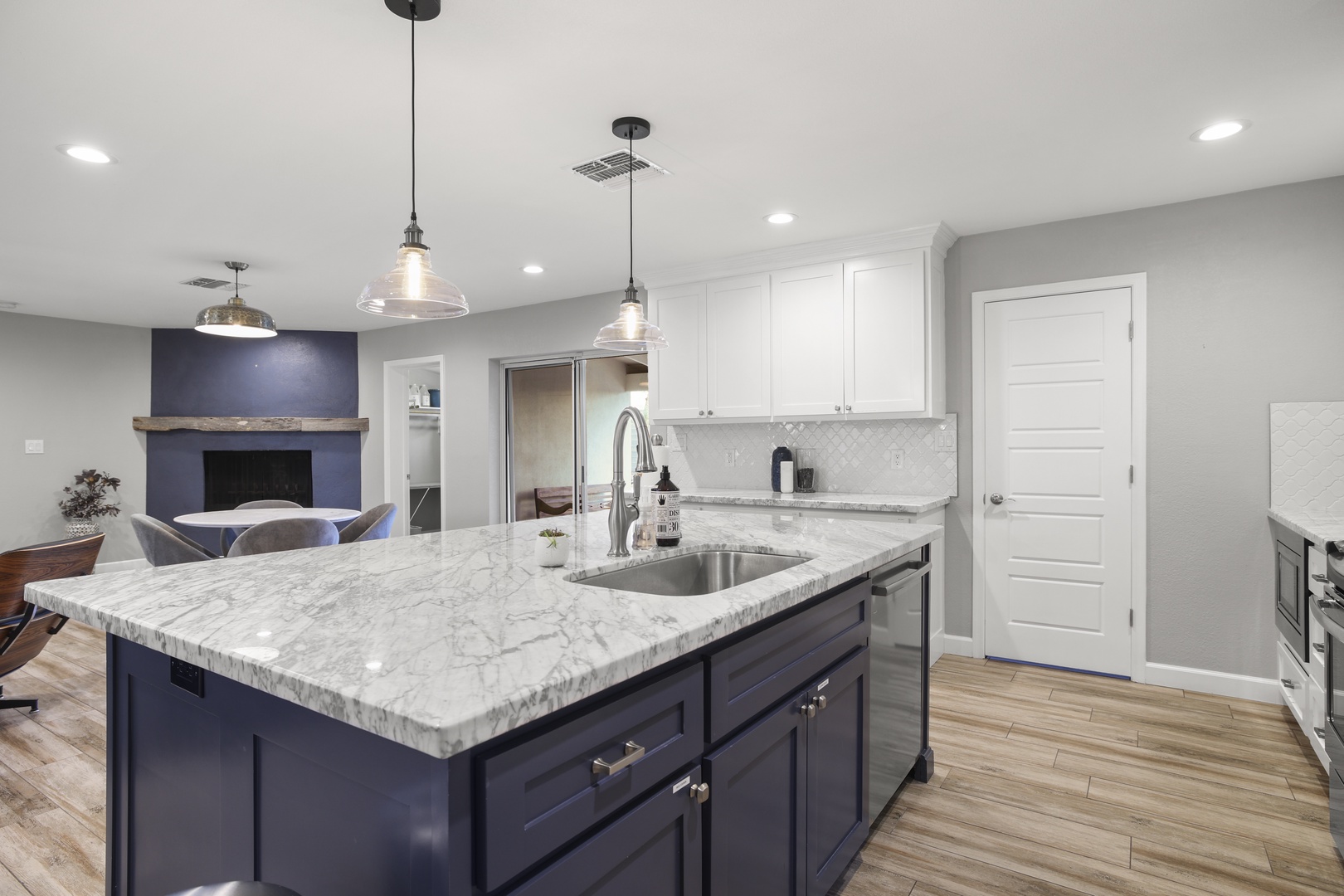 Beautiful chefs kitchen with large kitchen island and bar stools