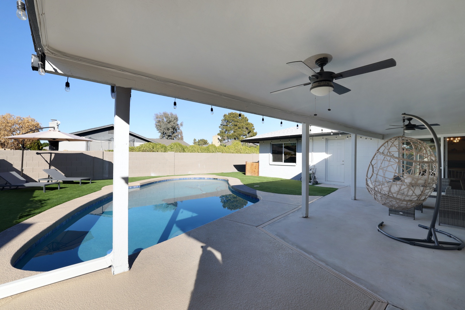 Covered patio lounge and egg hammock chair