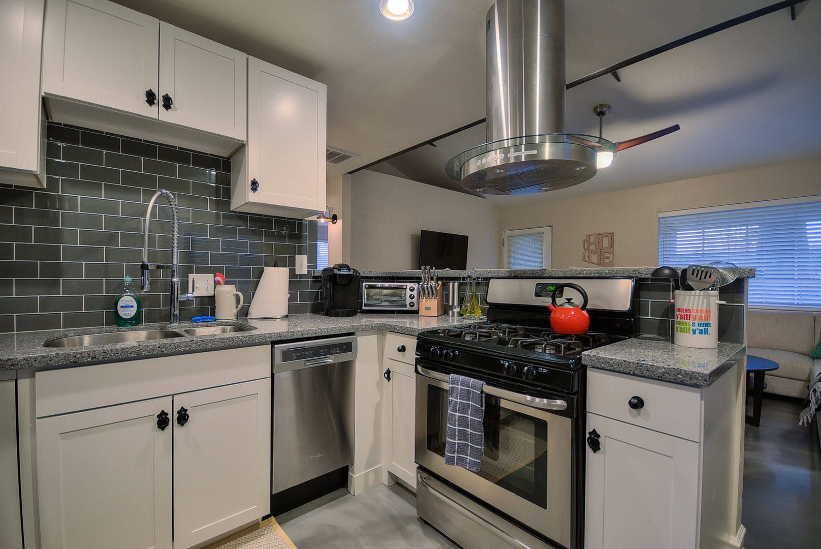 Modern stainless steel appliances including: dishwasher, refrigerator, stove top, microwave, toaster, K-cup coffee machine, kettle, pots and pans, and utensils for at least 8 guests.