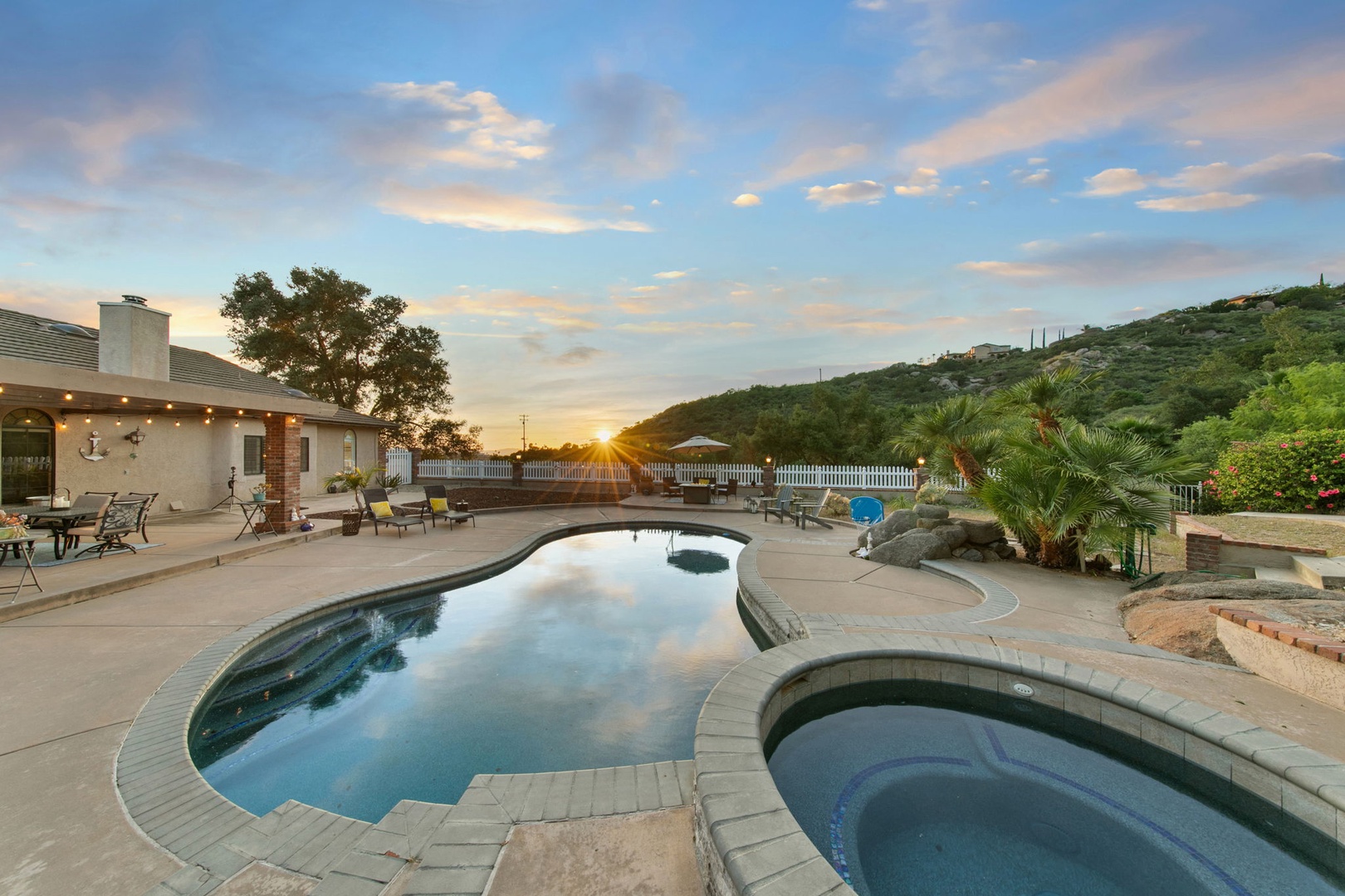 Watch stunning sunsets reflect in your private pool, surrounded by rolling hills and peaceful valley views.