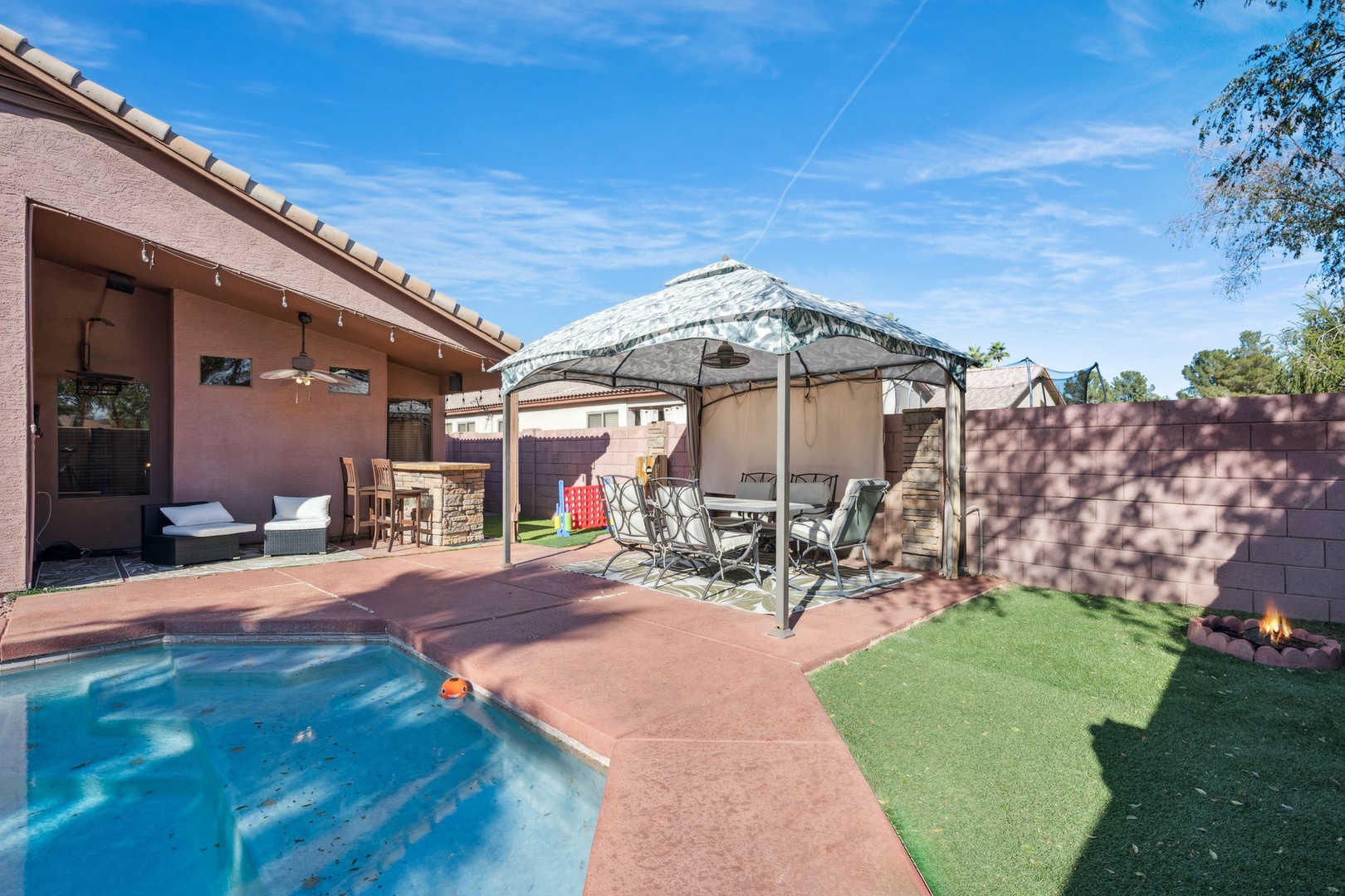 Your private backyard oasis awaits with sparkling pool, shaded gazebo seating, and peaceful patio space for ultimate relaxation.