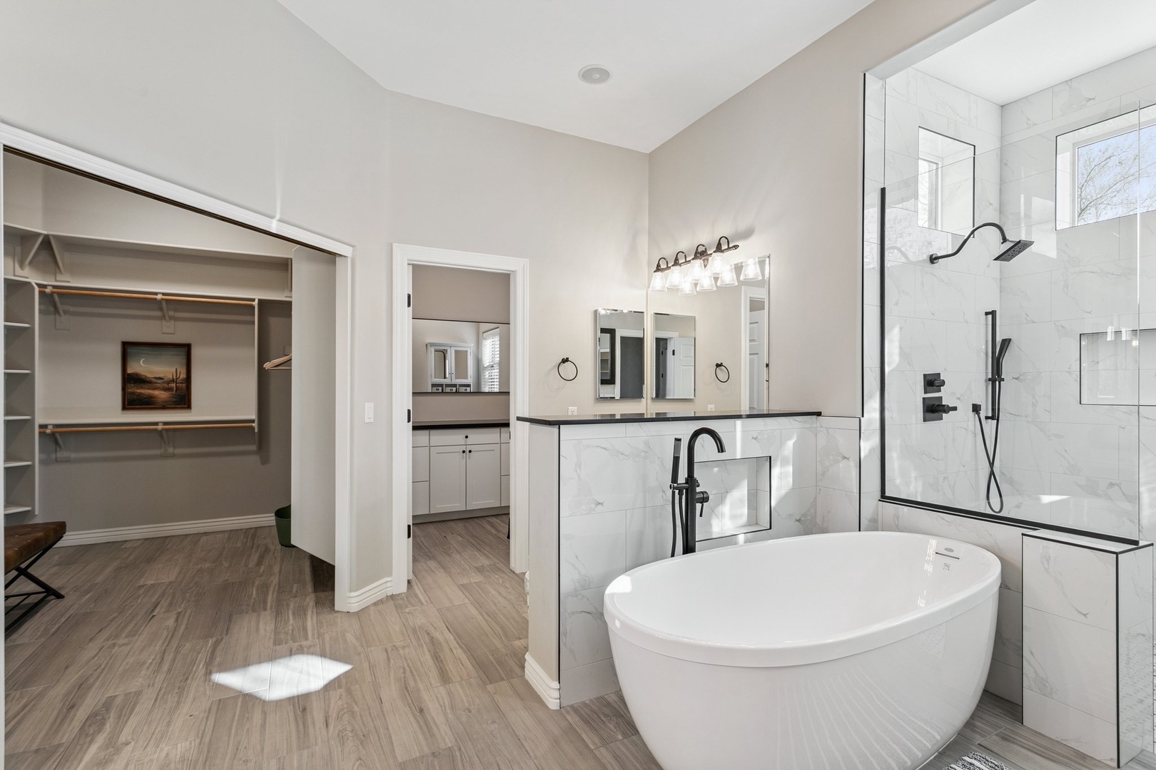 Unwind in your luxurious primary suite bathroom with a spa-like soaking tub and spacious walk-in closet for effortless organization.