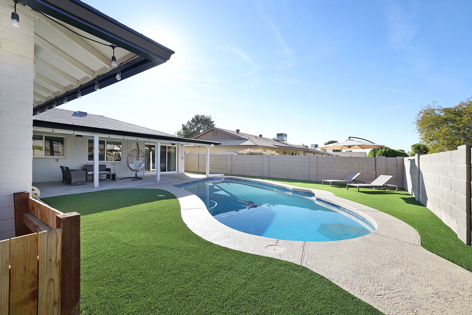 Comfortable patio and backyard with sparkling pool (newly resurfaced Nov 2020!). Enjoy the sun on the lounge chairs or relax in the addictive egg chair!