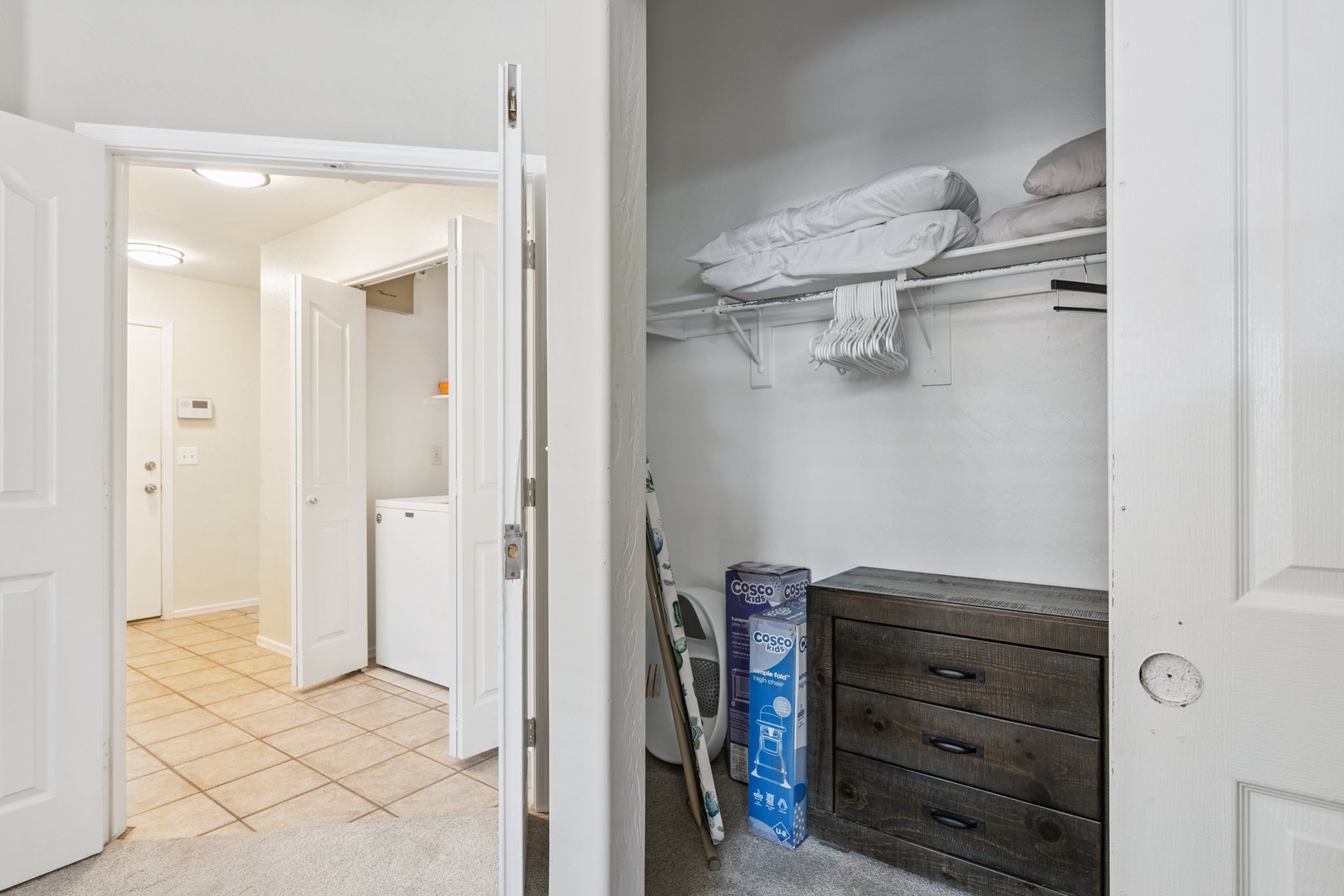 Your private walk-in closet offers organized storage with shelving, hanging space, and drawers to keep all your belongings perfectly arranged.