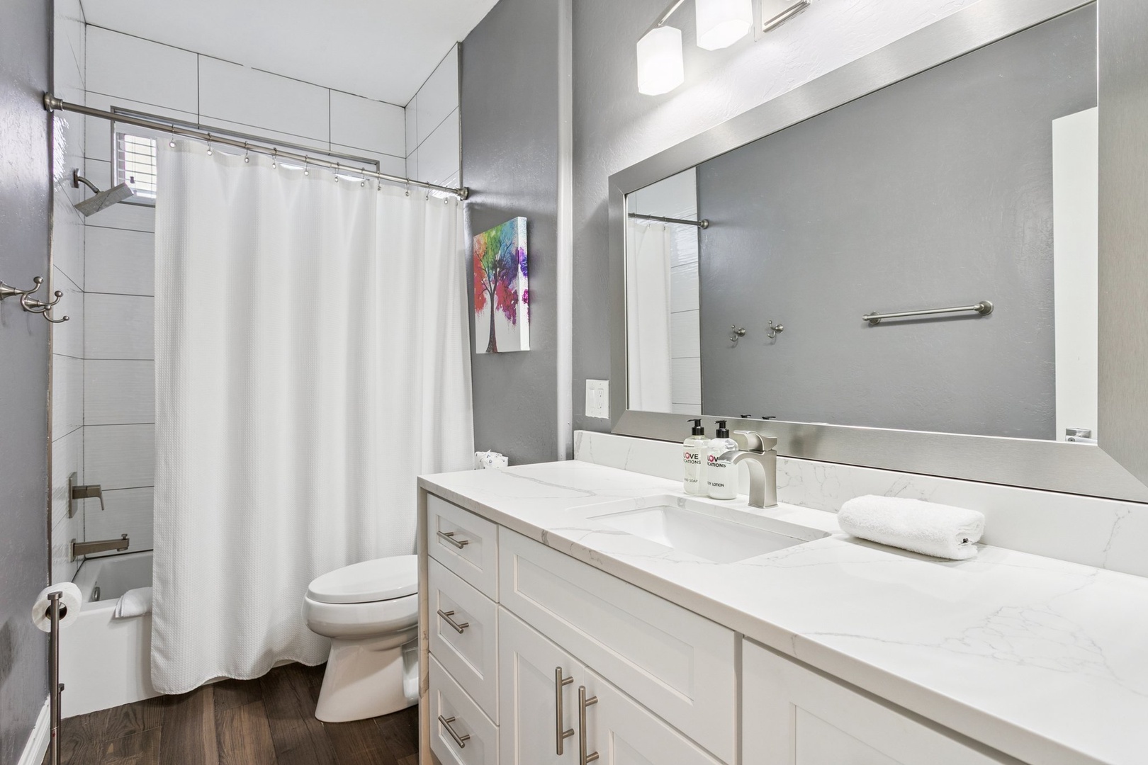 Your modern bathroom features a spacious vanity with marble countertops, fluffy towels, and a refreshing shower to start your day.